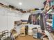 A walk-in closet with shelving and clothes at 1347 W Straford Ave, Gilbert, AZ 85233