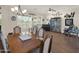 Elegant dining room featuring a large table, wood floors, and natural light at 1347 W Straford Ave, Gilbert, AZ 85233