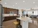 Modern kitchen with granite countertops, stainless steel appliances, and a center island at 1347 W Straford Ave, Gilbert, AZ 85233