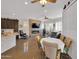 Spacious open concept living room, connected to kitchen and dining area, and modern fireplace at 1347 W Straford Ave, Gilbert, AZ 85233