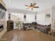 Spacious living room boasts a comfortable sectional sofa, modern fireplace, and lots of natural light at 1347 W Straford Ave, Gilbert, AZ 85233