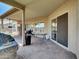 Covered patio with brick pavers and outdoor furniture at 1347 W Straford Ave, Gilbert, AZ 85233