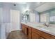 Well-lit bathroom featuring a dual sink vanity, and framed mirrors at 1520 E Flint St, Chandler, AZ 85225