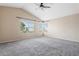 Large bedroom featuring vaulted ceiling, neutral color palette, and natural light from windows at 1520 E Flint St, Chandler, AZ 85225