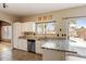 Open kitchen design with granite countertops, stainless steel appliances, and a view to the pool at 1520 E Flint St, Chandler, AZ 85225