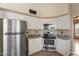 Well-equipped kitchen with stainless steel appliances and white cabinetry at 1520 E Flint St, Chandler, AZ 85225