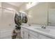 Bathroom with a double sink vanity, large mirror, and shower with modern shower curtain at 3109 N Meadow Dr, Avondale, AZ 85392