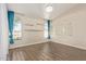 Bright bedroom features wood floors, arched windows, and a view of the outdoors at 3109 N Meadow Dr, Avondale, AZ 85392