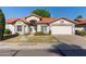 Charming single-story home with a red tile roof, well-kept lawn, and a two-car garage at 3109 N Meadow Dr, Avondale, AZ 85392
