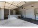 Spacious garage with a partially finished wall and ample room for storage at 3109 N Meadow Dr, Avondale, AZ 85392