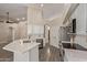 Well-lit kitchen features stainless steel appliances, white cabinetry and quartz countertops at 3109 N Meadow Dr, Avondale, AZ 85392
