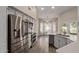 Modern kitchen featuring stainless steel appliances, white cabinets, and a breakfast nook with backyard views at 3109 N Meadow Dr, Avondale, AZ 85392