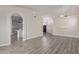 Open-concept living space with hardwood floors and seamless flow into the kitchen and dining area at 3109 N Meadow Dr, Avondale, AZ 85392