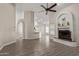 Spacious living area with hardwood floors, fireplace, and open layout perfect for entertaining at 3109 N Meadow Dr, Avondale, AZ 85392