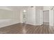 Open main bedroom with ensuite bathroom and mirrored closet doors at 3109 N Meadow Dr, Avondale, AZ 85392