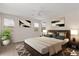 Cozy bedroom with a king bed, ceiling fan, neutral colors, and two bedside tables at 4119 E Sundance Ave, Gilbert, AZ 85297