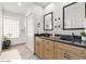 Well-lit bathroom with double sinks, granite countertops, and stylish fixtures, creating a spa-like experience at 4534 E Beverly Ln, Phoenix, AZ 85032