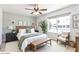 Inviting bedroom with a large window, a ceiling fan, and tasteful decor, offering comfort and style at 4534 E Beverly Ln, Phoenix, AZ 85032