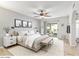 Sunlit main bedroom with a sliding glass door to the backyard and neutral decor at 4534 E Beverly Ln, Phoenix, AZ 85032