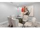 Elegant dining room with a modern light fixture and an eye-catching painting at 5962 E Abraham Ln, Phoenix, AZ 85054