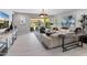 Spacious living room featuring neutral tones, stylish decor, tile flooring, and sliding doors to the patio at 5962 E Abraham Ln, Phoenix, AZ 85054