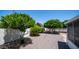 A well maintained backyard with lovely shrubbery and trees, and a block wall for privacy at 6258 E Duncan St, Mesa, AZ 85205
