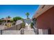 Backyard with privacy fence and shed, surrounded by mature trees and desert landscaping at 6258 E Duncan St, Mesa, AZ 85205
