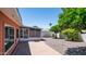 Sideyard featuring mature shade trees, screened in porch, and low maintenance desert landscaping at 6258 E Duncan St, Mesa, AZ 85205