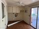 This bonus room features wood laminate flooring, exposed block and a sliding glass door at 6258 E Duncan St, Mesa, AZ 85205