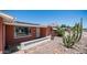 Charming single-story home with desert landscaping, solar panels, and covered front porch at 6258 E Duncan St, Mesa, AZ 85205