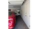 Well-maintained garage offers ample space and leads to an interior door, with painted brick walls at 6258 E Duncan St, Mesa, AZ 85205
