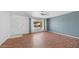 Inviting living room featuring wood-look floors, neutral paint, and a bright window at 6258 E Duncan St, Mesa, AZ 85205