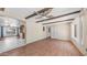 Bright living room with wood floors, wood beam ceiling, and open access to the dining room at 6258 E Duncan St, Mesa, AZ 85205