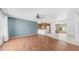 Open-concept living space with wood-look floors, leading into the kitchen and dining areas at 6258 E Duncan St, Mesa, AZ 85205