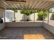 Relaxing covered patio offers a tranquil outdoor space with views of the landscaped backyard at 6258 E Duncan St, Mesa, AZ 85205