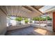 Covered patio with tiled floor offering a relaxing outdoor space with lush green views at 6258 E Duncan St, Mesa, AZ 85205