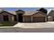 Charming one-story home with tile roof, desert landscaping, and a two car garage at , Gilbert, AZ 85233