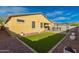 Artificial turf backyard with gravel landscaping and an open patio area at 10363 W Rosewood Ln, Peoria, AZ 85383