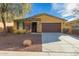 Charming single-story home featuring a low-maintenance front yard and a welcoming, covered entryway at 10363 W Rosewood Ln, Peoria, AZ 85383
