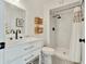 Well-lit bathroom with a vanity, white subway tile shower, and mosaic tile flooring at 10428 S 43Rd St, Phoenix, AZ 85044