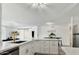 Spacious open kitchen with white cabinets, modern gold hardware and stainless steel appliances at 10428 S 43Rd St, Phoenix, AZ 85044