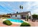 Backyard oasis featuring a sparkling pool, desert landscaping, and lounge seating at 10428 S 43Rd St, Phoenix, AZ 85044