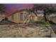 The backyard features a play structure and a beautiful sunset at 10775 W Davis Ln, Avondale, AZ 85323