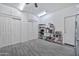 Large flex room features laminate floors and storage space at 10775 W Davis Ln, Avondale, AZ 85323