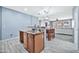 Open-concept kitchen area complete with breakfast bar and view of the living room at 10775 W Davis Ln, Avondale, AZ 85323