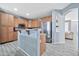 Bright kitchen with stainless steel appliances, stylish wood cabinets, and open floor plan at 10775 W Davis Ln, Avondale, AZ 85323