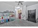 Large laundry room with grey floors, a washer and dryer, and a freezer at 10775 W Davis Ln, Avondale, AZ 85323