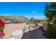 Expansive front yard with mountain views, desert landscaping and a cozy seating area at 11099 E Desert Vista Dr, Scottsdale, AZ 85255