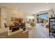 Expansive great room with dining and living areas, large windows offering scenic views and seamless indoor-outdoor living at 11099 E Desert Vista Dr, Scottsdale, AZ 85255