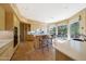 Eat-in kitchen featuring stone floors, countertops and breakfast bar at 11099 E Desert Vista Dr, Scottsdale, AZ 85255